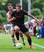 13 June 2025; George Cooper of Drogheda United in action against Anto Breslin of St Patrick's Athletic during the SSE Airtricity Men's Premier Division match between St Patrick's Athletic and Drogheda United at Richmond Park in Dublin. Photo by Shauna Clinton/Sportsfile