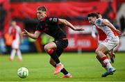 13 June 2025; George Cooper of Drogheda United in action against Simon Power of St Patrick's Athletic during the SSE Airtricity Men's Premier Division match between St Patrick's Athletic and Drogheda United at Richmond Park in Dublin. Photo by Shauna Clinton/Sportsfile