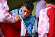 13 June 2025; Kian Leavy of St Patrick's Athletic signs autographs for supporters before the SSE Airtricity Men's Premier Division match between St Patrick's Athletic and Drogheda United at Richmond Park in Dublin. Photo by Shauna Clinton/Sportsfile