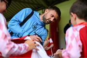 13 June 2025; St Patrick's Athletic goalkeeper Danny Rogers signs autographs for supporters before the SSE Airtricity Men's Premier Division match between St Patrick's Athletic and Drogheda United at Richmond Park in Dublin. Photo by Shauna Clinton/Sportsfile