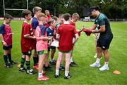 20 June 2025; James Lowe of British & Irish Lions signs autographs during a British & Irish Lions community engagement event with pupils from Moorefields Primary school in Antrim, St Colombia's National School in Dublin, Clerigan National School in Tipperary and St Brendan's National School in Galway at UCD Bowl in Dublin. Photo by Brendan Moran/Sportsfile