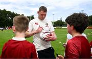 20 June 2025; Finn Russell signs autographs during a British & Irish Lions community engagement event with pupils from Moorefields Primary school in Antrim, St Colombia's National School in Dublin, Clerigan National School in Tipperary and St Brendan's National School in Galway at UCD Bowl in Dublin. Photo by Brendan Moran/Sportsfile