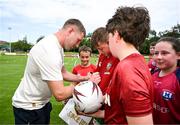 20 June 2025; Finn Russell signs autographs during a British & Irish Lions community engagement event with pupils from Moorefields Primary school in Antrim, St Colombia's National School in Dublin, Clerigan National School in Tipperary and St Brendan's National School in Galway at UCD Bowl in Dublin. Photo by Brendan Moran/Sportsfile