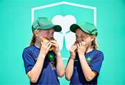 20 June 2025; Maria Peck, aged 10, left, and her sister Eimear Peck, aged 8, enjoy a burger during the Irish Olympians’ Association summer barbecue at Olympic House on the Sport Ireland Campus in Dublin. Photo by Sam Barnes/Sportsfile