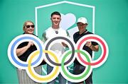 20 June 2025; Olympic Gold medallist in Gymnastics Rhys McClenaghan OLY, centre, pictured with his mother Tracy and father Danny  during the Irish Olympians’ Association summer barbecue at Olympic House on the Sport Ireland Campus in Dublin. Photo by Sam Barnes/Sportsfile