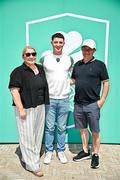20 June 2025; Olympic Gold medallist in Gymnastics Rhys McClenaghan OLY, centre, pictured with his mother Tracy and father Danny  during the Irish Olympians’ Association summer barbecue at Olympic House on the Sport Ireland Campus in Dublin. Photo by Sam Barnes/Sportsfile