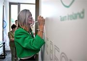 20 June 2025; President of the Irish Olympians Association Roisin McGettigan OLY, signs the autograph wall during the Irish Olympians’ Association summer barbecue at Olympic House on the Sport Ireland Campus in Dublin. Photo by Sam Barnes/Sportsfile