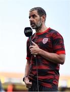 20 June 2025; Derry City manager Tiernan Lynch is interviewed before the SSE Airtricity Men's Premier Division match between Shelbourne and Derry City at Tolka Park in Dublin. Photo by Thomas Flinkow/Sportsfile