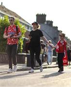 20 June 2025; Shelbourne supporters make their way to the grounds before the SSE Airtricity Men's Premier Division match between Shelbourne and Derry City at Tolka Park in Dublin. Photo by Thomas Flinkow/Sportsfile