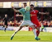 20 June 2025; Ronan Boyce of Derry City in action against John Martin of Shelbourne during the SSE Airtricity Men's Premier Division match between Shelbourne and Derry City at Tolka Park in Dublin. Photo by Thomas Flinkow/Sportsfile