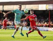 20 June 2025; Ronan Boyce of Derry City in action against John Martin of Shelbourne during the SSE Airtricity Men's Premier Division match between Shelbourne and Derry City at Tolka Park in Dublin. Photo by Thomas Flinkow/Sportsfile