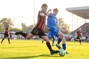20 June 2025; Colm Whelan of Bohemians in action against Jesse Dempsey of Waterford during the SSE Airtricity Men's Premier Division match between Waterford and Bohemians at the Regional Sports Centre in Waterford. Photo by Ben McShane/Sportsfile