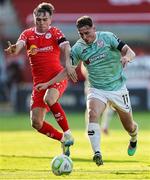 20 June 2025; Gavin Whyte of Derry City in action against James Norris of Shelbourne during the SSE Airtricity Men's Premier Division match between Shelbourne and Derry City at Tolka Park in Dublin. Photo by Thomas Flinkow/Sportsfile