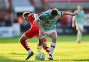 20 June 2025; Gavin Whyte of Derry City is tackled by James Norris of Shelbourne during the SSE Airtricity Men's Premier Division match between Shelbourne and Derry City at Tolka Park in Dublin. Photo by Thomas Flinkow/Sportsfile