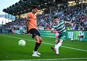 20 June 2025; Trevor Clarke of Shamrock Rovers in action against Freddie Anderson of Cork City during the SSE Airtricity Men's Premier Division match between Shamrock Rovers and Cork City at Tallaght Stadium in Dublin. Photo by David Fitzgerald/Sportsfile