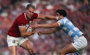 20 June 2025; Duhan van der Merwe of British & Irish Lions is tackled by Lucio Cinti of Argentina during the Lions 1888 Cup match between the British & Irish Lions and Argentina at the Aviva Stadium in Dublin. Photo by Brendan Moran/Sportsfile