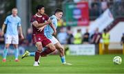 20 June 2025; Moses Dyer of Galway United in action against Joe Redmond of St Patrick's Athletic during the SSE Airtricity Men's Premier Division match between Galway United and St Patrick's Athletic at Eamonn Deacy Park in Galway. Photo by Piaras Ó Mídheach/Sportsfile