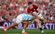 20 June 2025; Tommy Freeman of British & Irish Lions is tackled by Justo Piccardo of Argentina during the Lions 1888 Cup match between the British & Irish Lions and Argentina at the Aviva Stadium in Dublin. Photo by Brendan Moran/Sportsfile
