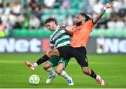 20 June 2025; Dylan Watts of Shamrock Rovers in action against Milan Mbeng of Cork City during the SSE Airtricity Men's Premier Division match between Shamrock Rovers and Cork City at Tallaght Stadium in Dublin. Photo by David Fitzgerald/Sportsfile