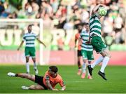 20 June 2025; Rory Gaffney of Shamrock Rovers in action against Evan McLaughlin of Cork City during the SSE Airtricity Men's Premier Division match between Shamrock Rovers and Cork City at Tallaght Stadium in Dublin. Photo by David Fitzgerald/Sportsfile