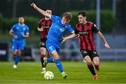 20 June 2025; Conan Noonan of Waterford in action against Dawson Devoy of Bohemians during the SSE Airtricity Men's Premier Division match between Waterford and Bohemians at the Regional Sports Centre in Waterford. Photo by Ben McShane/Sportsfile