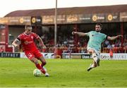 20 June 2025; Evan Caffrey of Shelbourne in action against Michael Duffy of Derry City during the SSE Airtricity Men's Premier Division match between Shelbourne and Derry City at Tolka Park in Dublin. Photo by Thomas Flinkow/Sportsfile