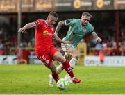 20 June 2025; JJ Lunney of Shelbourne in action against Carl Winchester during the SSE Airtricity Men's Premier Division match between Shelbourne and Derry City at Tolka Park in Dublin. Photo by Thomas Flinkow/Sportsfile