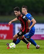 20 June 2025; Dawson Devoy of Bohemians in action against Tommy Lonergan of Waterford during the SSE Airtricity Men's Premier Division match between Waterford and Bohemians at the Regional Sports Centre in Waterford. Photo by Ben McShane/Sportsfile