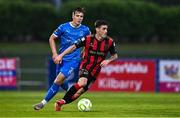 20 June 2025; Dawson Devoy of Bohemians in action against Tommy Lonergan of Waterford during the SSE Airtricity Men's Premier Division match between Waterford and Bohemians at the Regional Sports Centre in Waterford. Photo by Ben McShane/Sportsfile