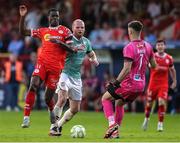 20 June 2025; Mipo Odubeko of Shelbourne in action against Mark Connolly of Derry City and goalkeeper Brian Maher during the SSE Airtricity Men's Premier Division match between Shelbourne and Derry City at Tolka Park in Dublin. Photo by Thomas Flinkow/Sportsfile