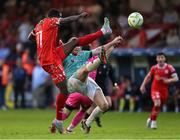 20 June 2025; Mipo Odubeko of Shelbourne attempts a shot on goal despite the efforts of Mark Connolly of Derry City and goalkeeper Brian Maher during the SSE Airtricity Men's Premier Division match between Shelbourne and Derry City at Tolka Park in Dublin. Photo by Thomas Flinkow/Sportsfile