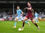 20 June 2025; Patrick Hickey of Galway United in action against Jamie Lennon of St Patrick's Athletic during the SSE Airtricity Men's Premier Division match between Galway United and St Patrick's Athletic at Eamonn Deacy Park in Galway. Photo by Piaras Ó Mídheach/Sportsfile