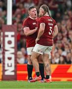 20 June 2025; Finlay Bealham of British & Irish Lions, right, comes on a substitute for team-mate Tadhg Furlong as he leaves the pitch for HIA during the Lions 1888 Cup match between the British & Irish Lions and Argentina at the Aviva Stadium in Dublin. Photo by Brendan Moran/Sportsfile
