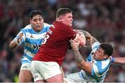 20 June 2025; Tadhg Furlong of British & Irish Lions is tackled by Argentina players Boris Wenger, left, and Francisco Coria Marchetti during the Lions 1888 Cup match between the British & Irish Lions and Argentina at the Aviva Stadium in Dublin. Photo by Brendan Moran/Sportsfile