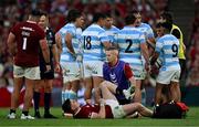 20 June 2025; Tommy Freeman of British & Irish Lions receives medical attention from team doctor Ciaran Cosgrove during the Lions 1888 Cup match between the British & Irish Lions and Argentina at the Aviva Stadium in Dublin. Photo by Brendan Moran/Sportsfile