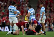 20 June 2025; Tommy Freeman of British & Irish Lions receives medical attention from team doctor Ciaran Cosgrove during the Lions 1888 Cup match between the British & Irish Lions and Argentina at the Aviva Stadium in Dublin. Photo by Brendan Moran/Sportsfile
