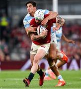 20 June 2025; Mack Hansen of British & Irish Lions is tackled by Lucio Cinti of Argentina during the Lions 1888 Cup match between the British & Irish Lions and Argentina at the Aviva Stadium in Dublin. Photo by Ramsey Cardy/Sportsfile