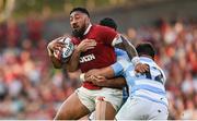 20 June 2025; Bundee Aki of British & Irish Lions is tackled by Argentina players Joaquin Oviedo, left, and Justo Piccardo during the Lions 1888 Cup match between the British & Irish Lions and Argentina at the Aviva Stadium in Dublin. Photo by Ramsey Cardy/Sportsfile