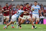 20 June 2025; Sione Tuipulotu of British & Irish Lions is tackled by Tomas Albornoz of Argentina during the Lions 1888 Cup match between the British & Irish Lions and Argentina at the Aviva Stadium in Dublin. Photo by Ramsey Cardy/Sportsfile
