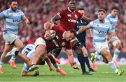 20 June 2025; Ellis Genge of British & Irish Lions is tackled by Santiago Carreras of Argentina during the Lions 1888 Cup match between the British & Irish Lions and Argentina at the Aviva Stadium in Dublin. Photo by Ramsey Cardy/Sportsfile