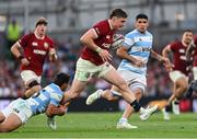 20 June 2025; Tommy Freeman of British & Irish Lions is tackled by Santiago Carreras of Argentina during the Lions 1888 Cup match between the British & Irish Lions and Argentina at the Aviva Stadium in Dublin. Photo by Ramsey Cardy/Sportsfile