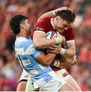 20 June 2025; Tommy Freeman of British & Irish Lions is tackled by Ignacio Mendy of Argentina during the Lions 1888 Cup match between the British & Irish Lions and Argentina at the Aviva Stadium in Dublin. Photo by Ramsey Cardy/Sportsfile