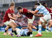 20 June 2025; Tommy Freeman of British & Irish Lions is tackled by Franco Molina of Argentina during the Lions 1888 Cup match between the British & Irish Lions and Argentina at the Aviva Stadium in Dublin. Photo by Ramsey Cardy/Sportsfile