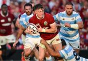 20 June 2025; Tommy Freeman of British & Irish Lions is tackled by Joaquin Oviedo of Argentina during the Lions 1888 Cup match between the British & Irish Lions and Argentina at the Aviva Stadium in Dublin. Photo by Brendan Moran/Sportsfile