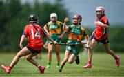 21 June 2025; Mia Wright of Blackwater St Brigid's in action against Eryn Sorenson of Blarney during the John West Féile na nGael Camogie and Hurling National Finals match between Blarney and Blackwater St Brigid's at Hailo Tiles Wexford GAA Centre of Excellence in Ferns, Wexford. Photo by Shauna Clinton/Sportsfile