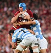 20 June 2025; Tadhg Beirne of British & Irish Lions is tackled by Juan Martín Gonzalez and Simón Benitez Cruz of Argentina during the Lions 1888 Cup match between the British & Irish Lions and Argentina at the Aviva Stadium in Dublin. Photo by Ramsey Cardy/Sportsfile