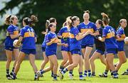 21 June 2025; Aishling Moloney of Tipperary, 14, and teammates warm-up before the TG4 All-Ireland Ladies Football Senior Championship Group 1 match between Tipperary and Donegal at Canon Hayes Park in Bansha, Tipperary. Photo by Seb Daly/Sportsfile