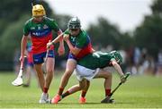21 June 2025; Cillian Moran of Shamrocks is tackled by MJ Kennedy of Cashel King Cormacs makes a pass during the John West Féile na nGael Camogie and Hurling National Finals match between Cashel King Cormacs and Shamrocks at Hailo Tiles Wexford GAA Centre of Excellence in Ferns, Wexford. Photo by Shauna Clinton/Sportsfile