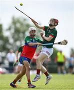 21 June 2025; Cathal Bonnar of Cashel King Cormacs in action against Rory Grennan of Shamrocks during the John West Féile na nGael Camogie and Hurling National Finals match between Cashel King Cormacs and Shamrocks at Hailo Tiles Wexford GAA Centre of Excellence in Ferns, Wexford. Photo by Shauna Clinton/Sportsfile