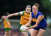 21 June 2025; Aishling Moloney of Tipperary in action against Roisin Rodgers of Donegal during the TG4 All-Ireland Ladies Football Senior Championship Group 1 match between Tipperary and Donegal at Canon Hayes Park in Bansha, Tipperary. Photo by Seb Daly/Sportsfile